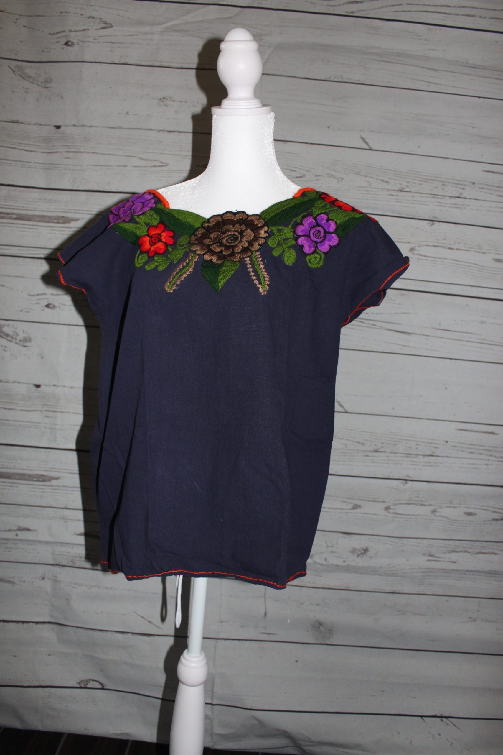 X-small Navy blue embroidered blouse with purple ,orange and brown flowers (green leaves)