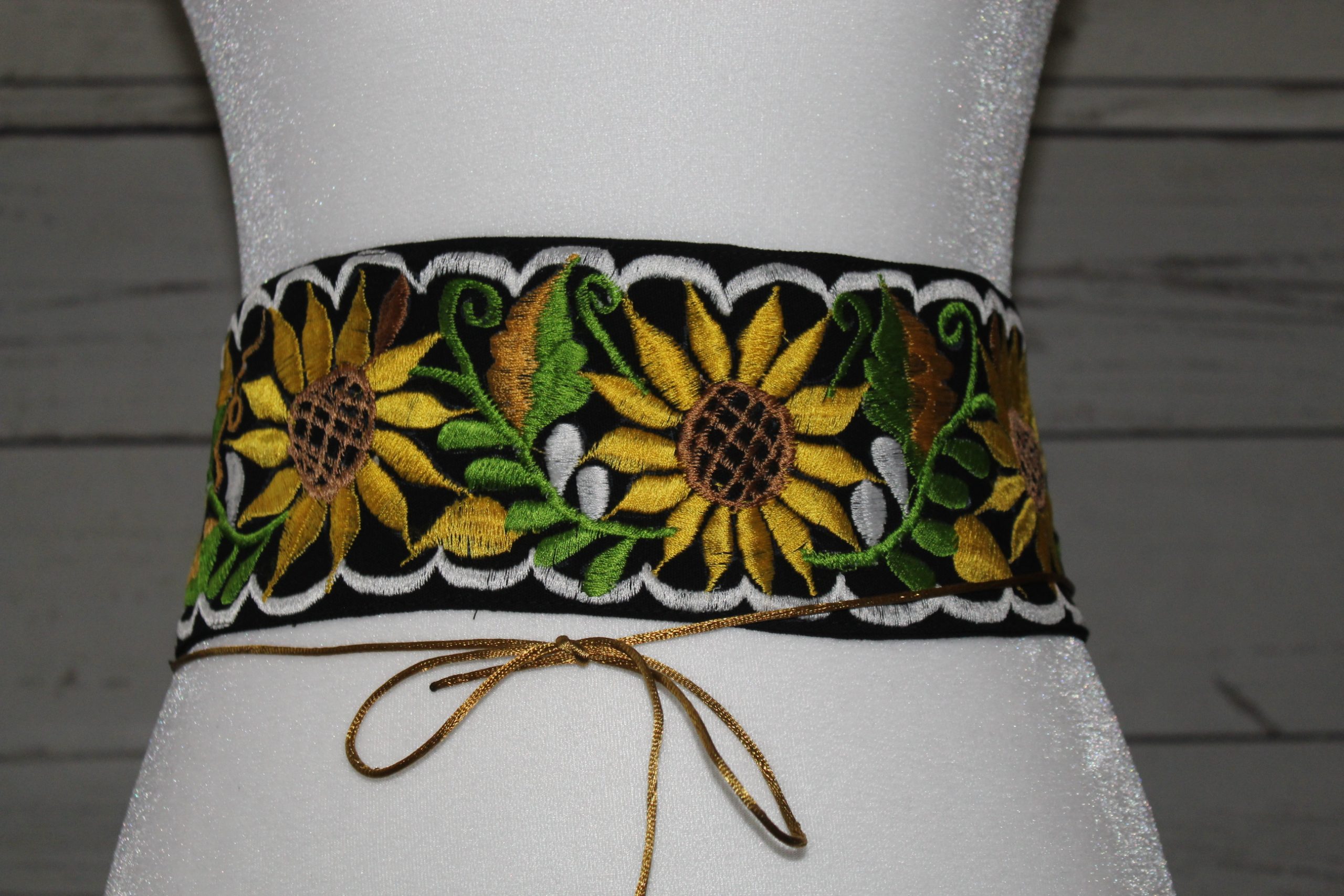 Black embordered belt with yellow sunflowers and white border