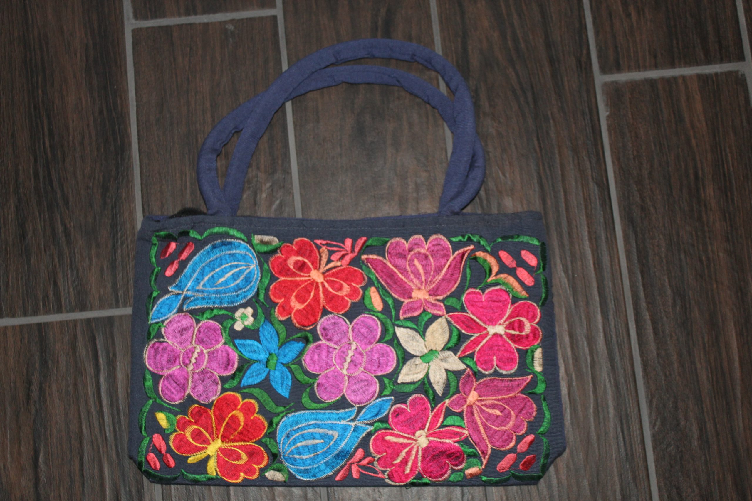 Zippered embroidered handbag